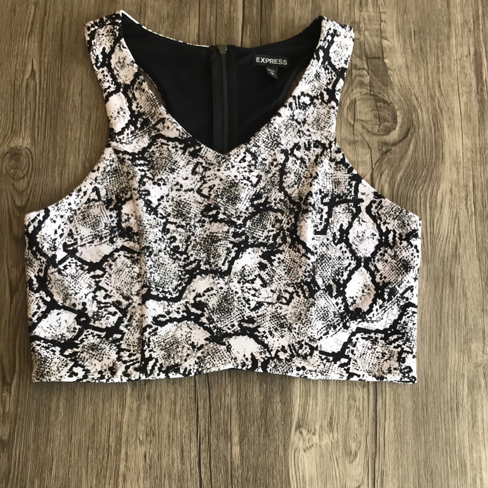 Express- crop top. Zipper back, sizes medium.